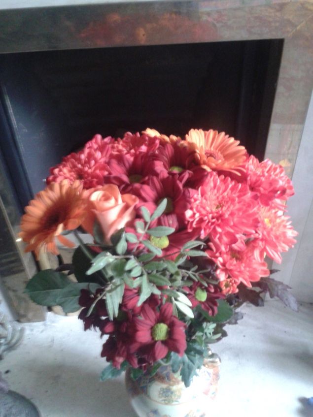 I have flowers of Autumn.
Daisies and dahlias,
Soft reds and burnt orange,
Glow on my hearth.
The spice of Christmas
Is in their chrysanthemum air,
Along with 
One last rose of Summer,
Standing pretty there.

